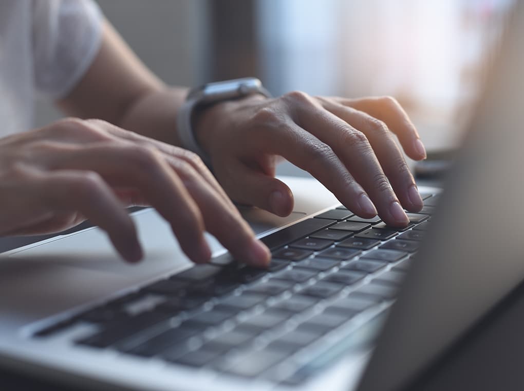 close,up,image,of,woman,hands,typing,on,laptop,computer